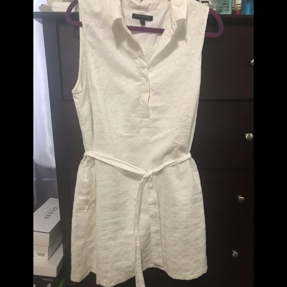 White eyelet summer dress with pockets.